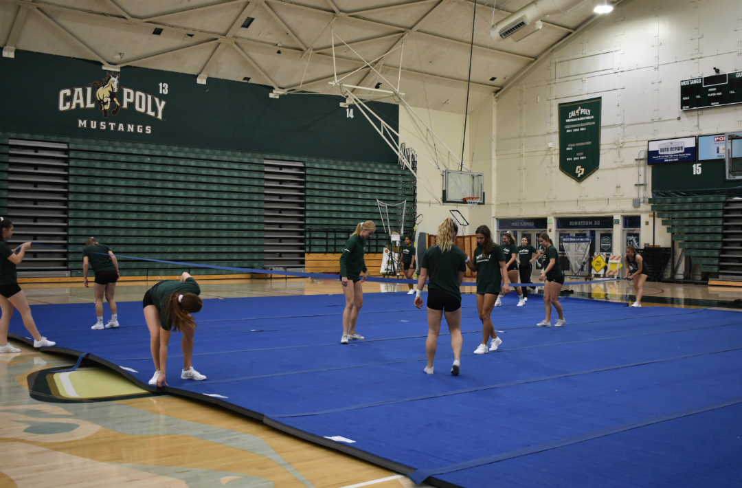 The team setting up the cheer mats at the beginning of practice (Mott Gym- 10/15/19)